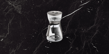 De’Longhi Clessidra filter coffee maker on dark marble background