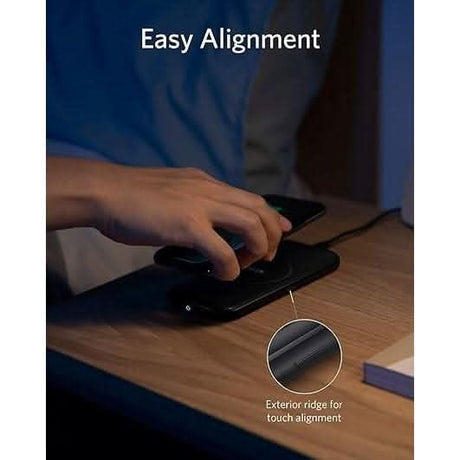 Anker fast wireless charger with easy alignment and exterior ridge for precise phone placement on wooden desk