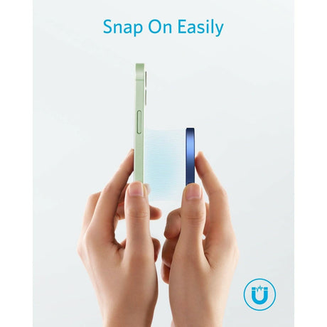 Hands holding a phone and Anker magnetic wireless charger snapping on easily for wireless charging