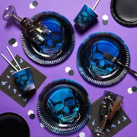 Halloween skull tablecover with blue skull plates and cups on a purple surface for spooky decoration
