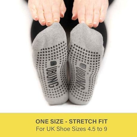 Gray women's yoga grip socks with non-slip dots and one size stretch fit for UK shoe sizes 4.5 to 9