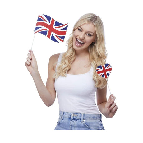 Woman holding Union Jack tableware props including a flag and heart-shaped decoration for party decorations