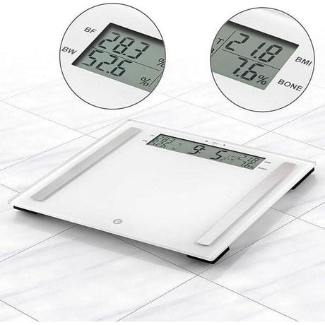 Weight Watchers glass scale with digital display showing body fat and BMI measurements on white floor