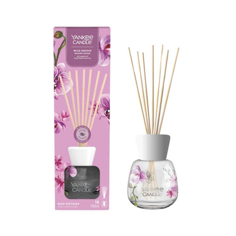 Yankee Candle wild orchid reed diffuser with floral design and scented sticks in glass bottle