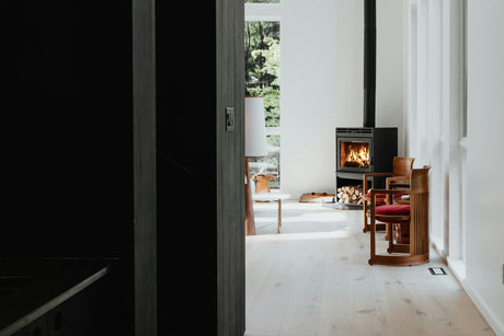 Cozy modern living room with a wood-burning convection heater showcasing the best convection heaters for home