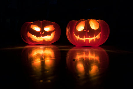 Glowing jack-o-lantern pumpkins with spooky faces for women's halloween decorations and spooky celebrations