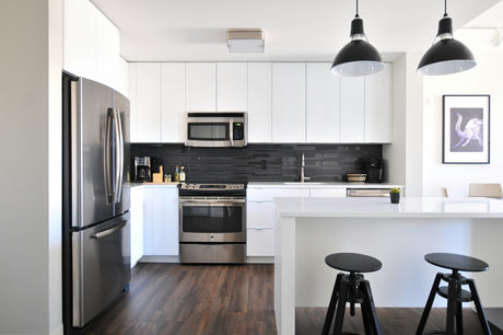 Modern kitchen with stainless steel appliances and sleek design showcasing homeware products coming soon