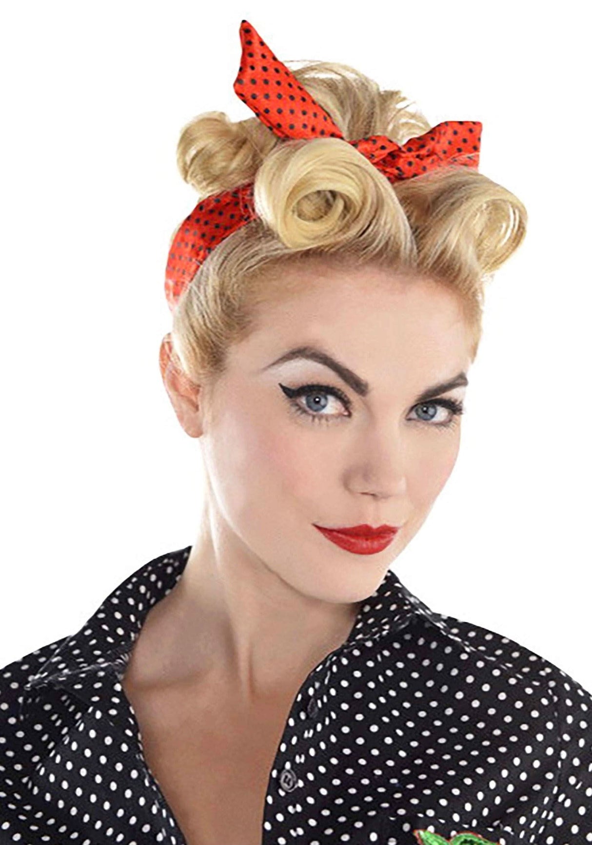 Blonde woman wearing a red polka dot 1960s rockabilly headscarf with vintage hairstyle and black polka dot blouse