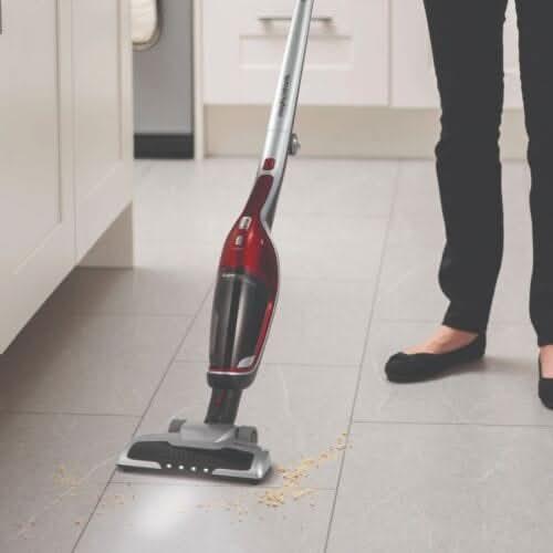 Morphy Richards 2-in-1 vacuum cleaner in action on tiled floor, perfect for quick clean-ups