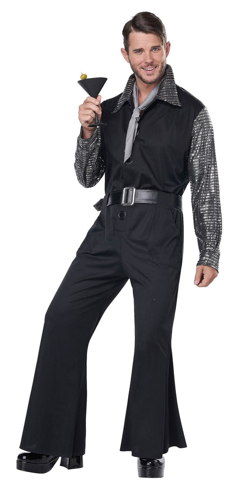 Man wearing a 70s men's jumpsuit costume with black flared pants and silver sequin sleeves holding a martini glass