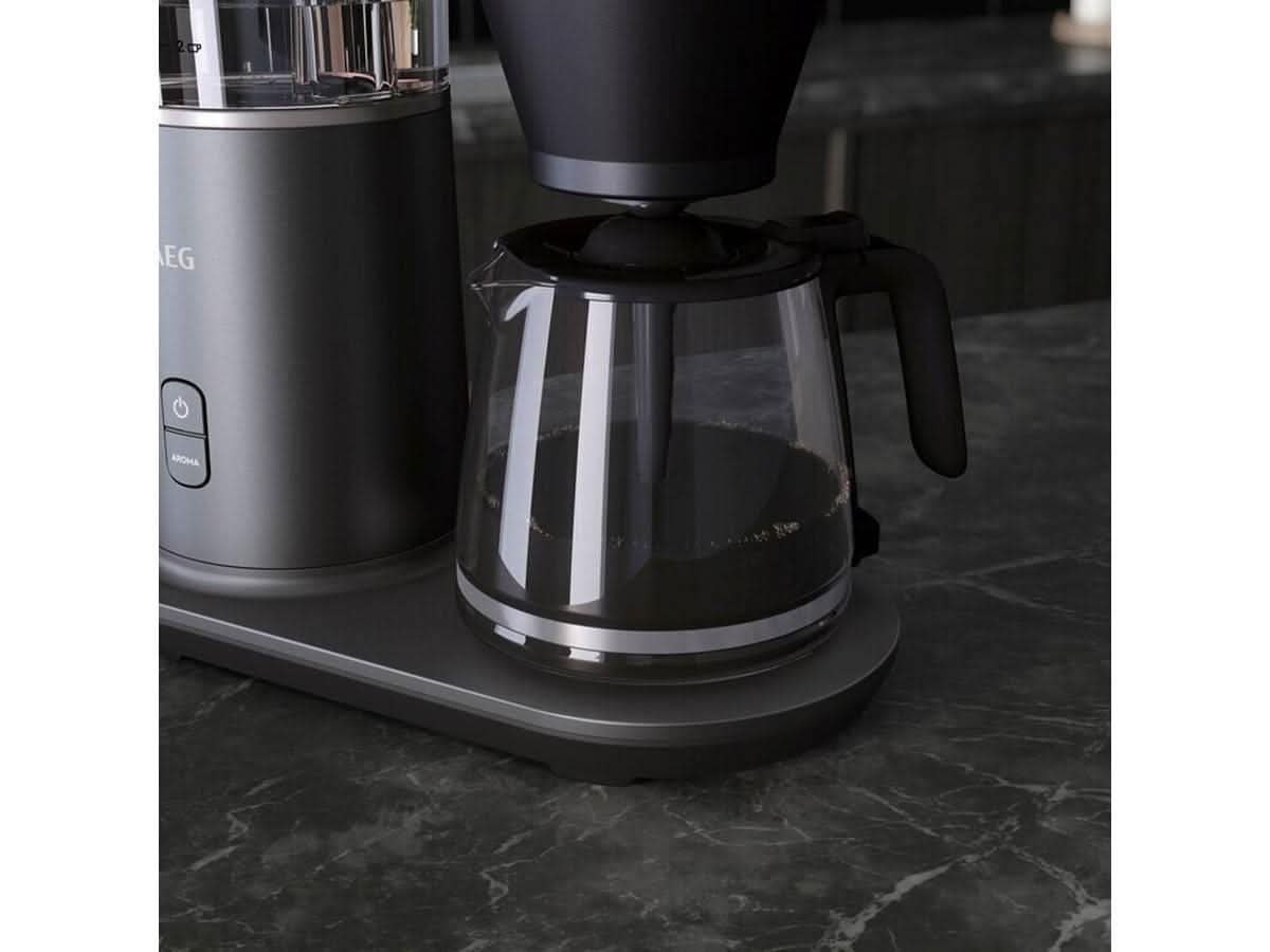 AEG coffee machine 1600W with glass carafe and black modern design on countertop