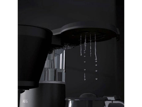AEG coffee machine 1600W brewing fresh coffee with water droplets falling from the filter basket
