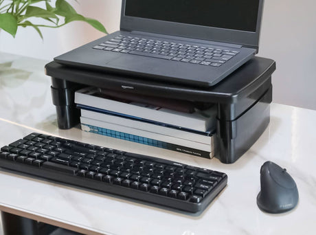 CLICKK Home Store adjustable monitor desk stand holding laptop with keyboard and mouse nearby