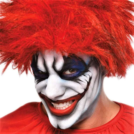 Clown face with white cream makeup, red wig, and red costume accessory from Fancy Dress