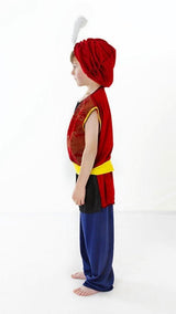Child wearing Arabian boy costume with red vest, blue pants, and red turban with white feather