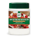 Ball jam setting mix with pectin in white container with green lid for making fresh strawberry jam