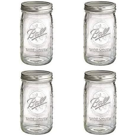 Set of four Ball wide mouth mason jars with silver lids for canning and storage