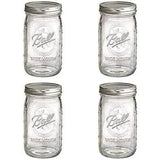 Set of four Ball wide mouth mason jars with silver lids for canning and storage