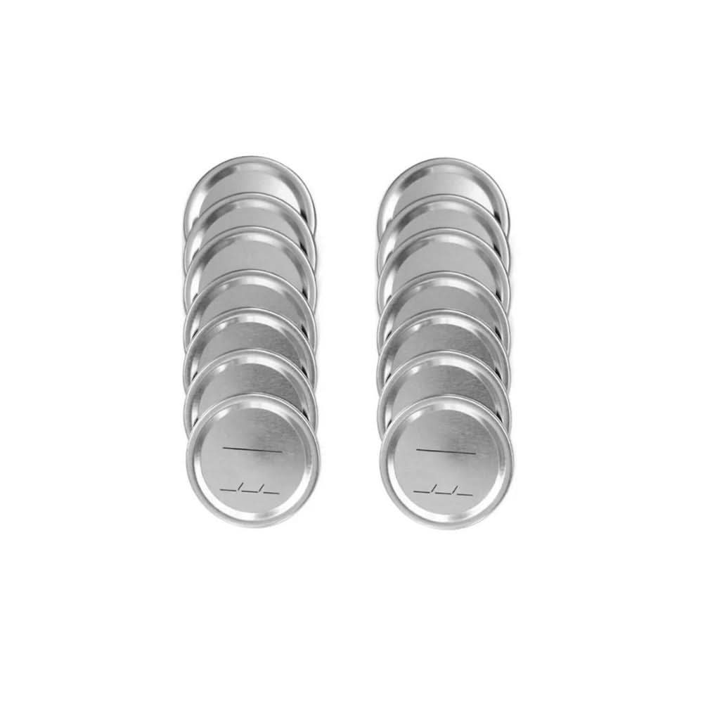Set of silver Ball wide mouth canning lids for Mason jars in two neat stacks