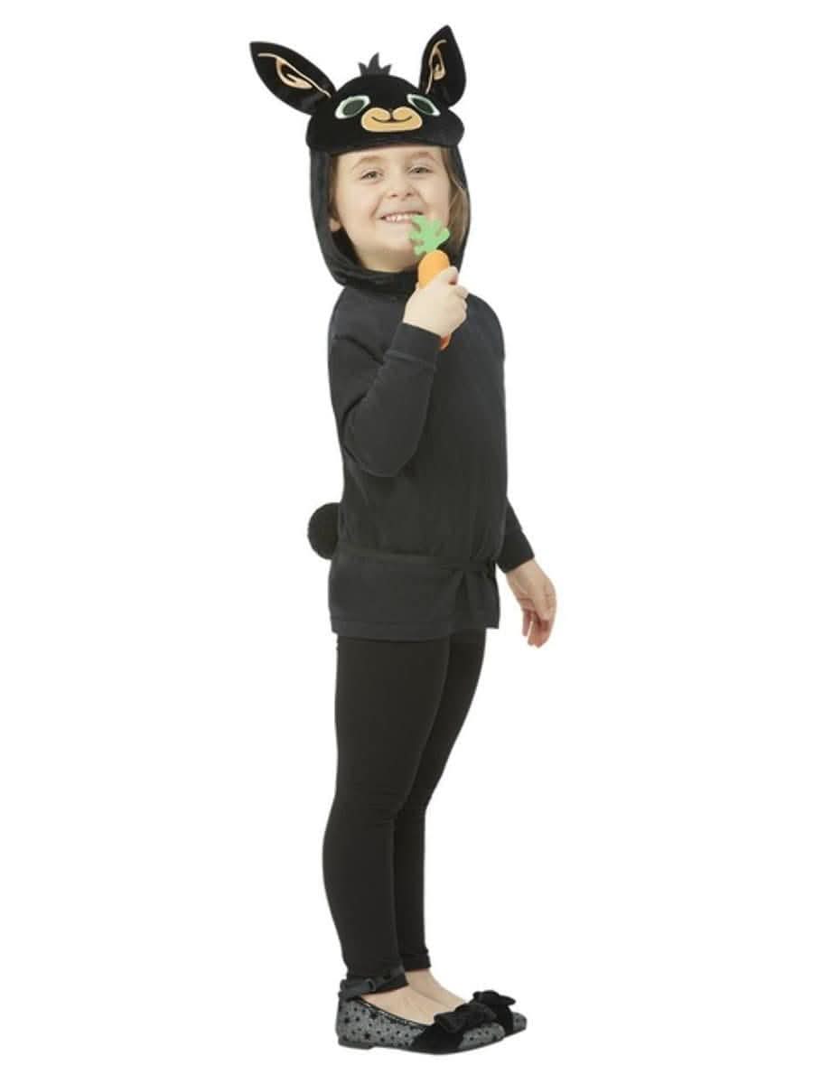 Child wearing Bing Bunny costume for kids with black outfit and bunny ears holding a carrot toy