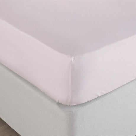 Soft blush king fitted sheet linen on a bed corner with smooth, wrinkle-free fabric