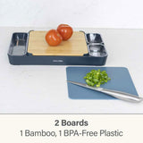 Calitek bamboo and plastic cutting board set with two boards and tomatoes on bamboo board