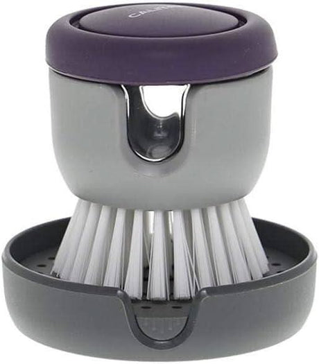 Calitek detergent dispensing dish brush with gray bristles and purple top with holder