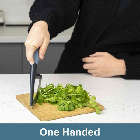 Calitek herb chopper mezzaluna with ergonomic handle chopping fresh herbs on wooden board