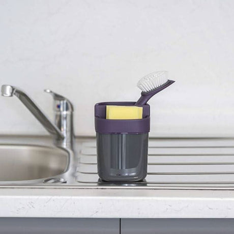 Calitek kitchen sink organizer with scrub brush and sponge holder in gray on countertop