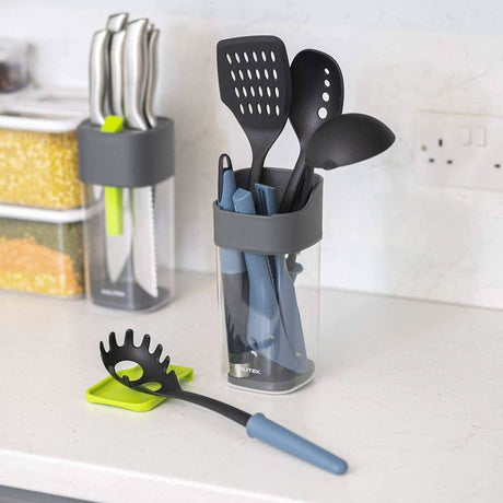 Calitek kitchen utensil holder with spoon rest holding black and blue cooking utensils on countertop