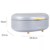 Modern bread bin with bamboo feet in gray with wooden handle and compact design