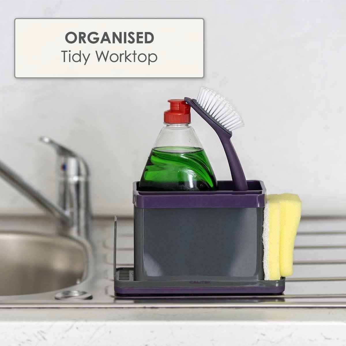 Calitek purple sink caddy organizer holding dish brush, sponge, and dish soap bottle on kitchen sink