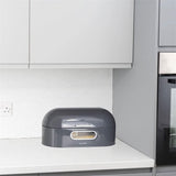 Calitek retro bread bin in dark gray on kitchen countertop with rounded edges