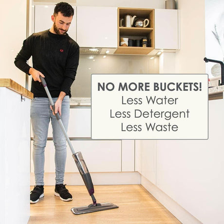 Man cleaning kitchen floor using Calitek spray mop with refillable bottle for easy cleaning