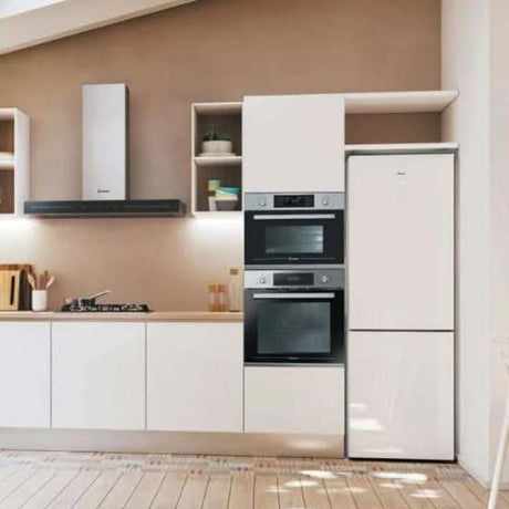 Modern kitchen featuring Candy built-in microwave oven and matching built-in appliances in a minimalist design