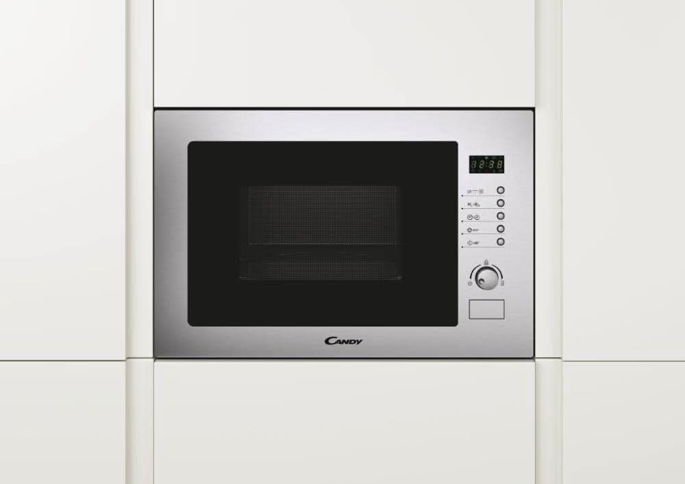 Candy built-in microwave with grill in stainless steel integrated into white kitchen cabinetry