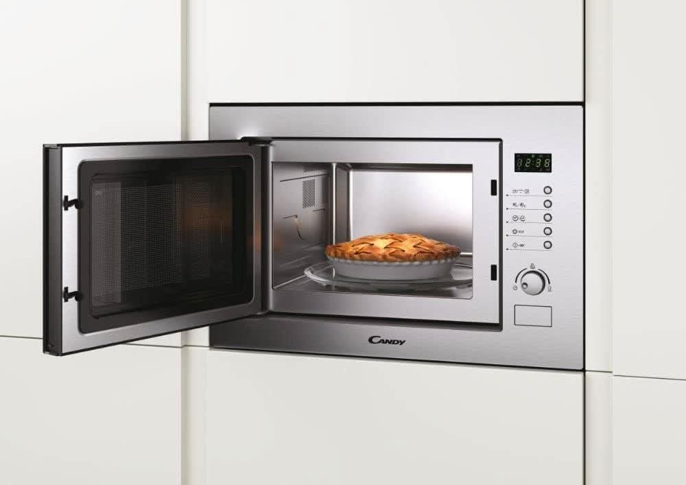 Built-in microwave with grill by CLICKK Home Store with stainless steel finish and open door showing pie inside