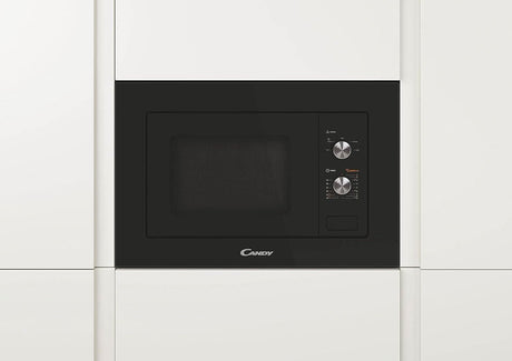 Candy built-in microwave 1000W installed in modern white kitchen cabinetry with black control panel