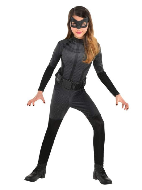 Girl wearing a black Catwoman costume for girls with mask and utility belt from Kids Fancy Dress