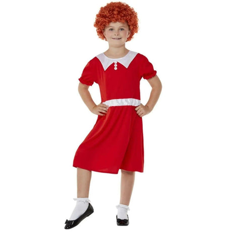 Child wearing a red and white child Annie costume with curly red wig and black shoes