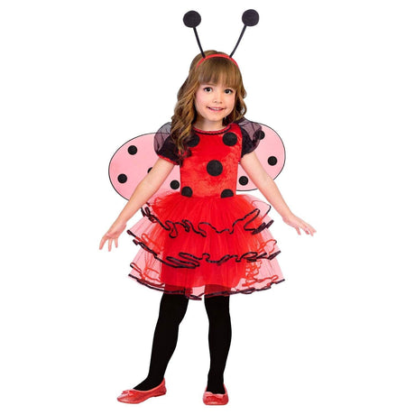 Child wearing child ladybird costume 4-6 years with red tutu dress black polka dots and antenna headband
