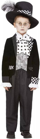 Child wearing a black and white child mad hatter costume with large hat and patterned bow tie