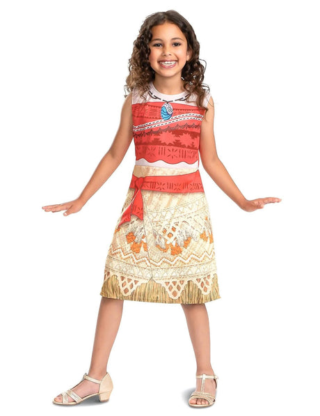 Smiling girl wearing Fancy Dress child Moana costume with red top and patterned skirt posing