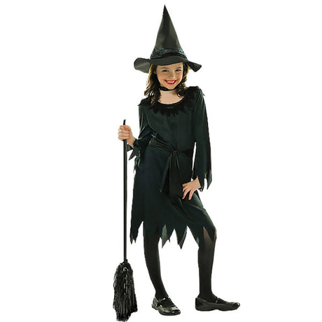 Young girl wearing black children's witch costume with pointed hat and holding a broomstick