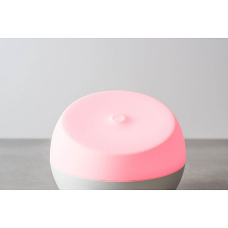 Homedics color changing essential oil diffuser with a pink light for relaxing aromatherapy
