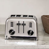 Stainless steel Cuisinart 4 slice toaster with dual control knobs and levers on kitchen countertop