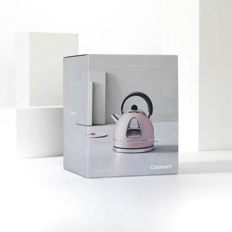Cuisinart stainless steel kettle in light pink color with black handle in packaging box