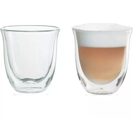 De'Longhi cappuccino glasses set with one empty and one filled with cappuccino and layered foam