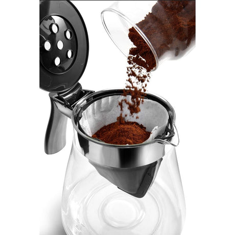 De'Longhi filter coffee maker in action pouring ground coffee into the adjustable filter basket