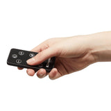 Hand holding remote control for Dimplex Heater Fan Adjustable Thermostat with power and temperature buttons
